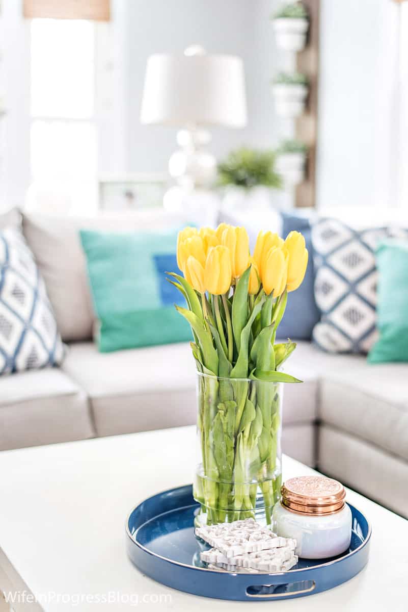 Yellow contrasts beautifully in a blue and green living room decor