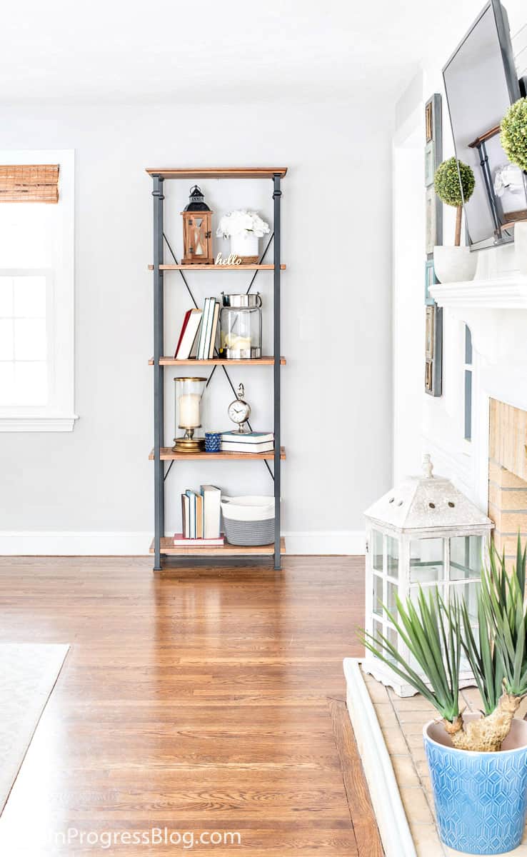 decorating with navy blue and green in a living room with gray paint color