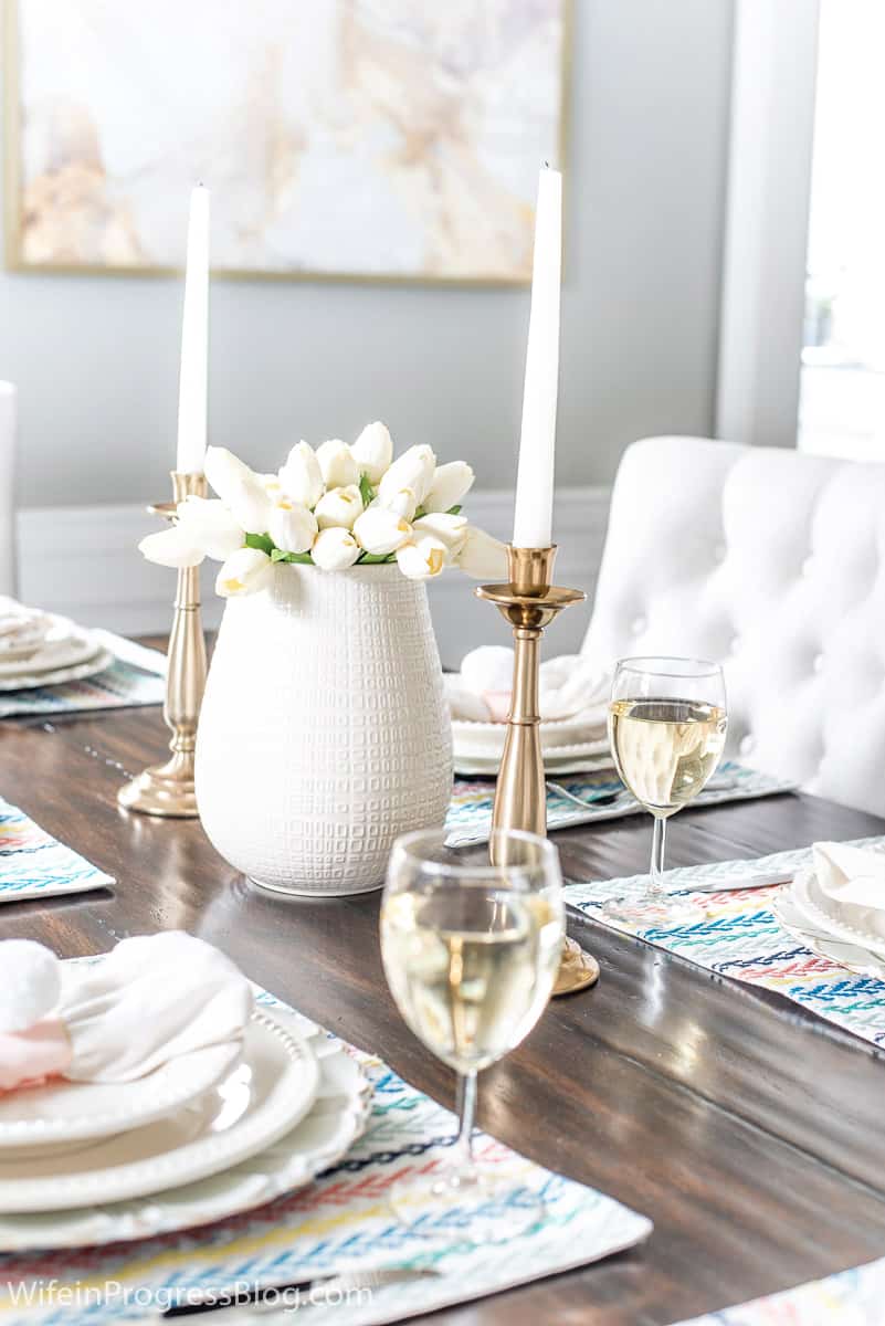 Simple Easter table decor with white tulips and colorful accents