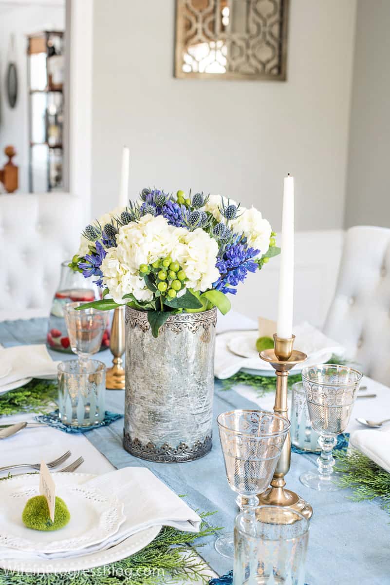 Blue green and white flowers in a spring tablescape