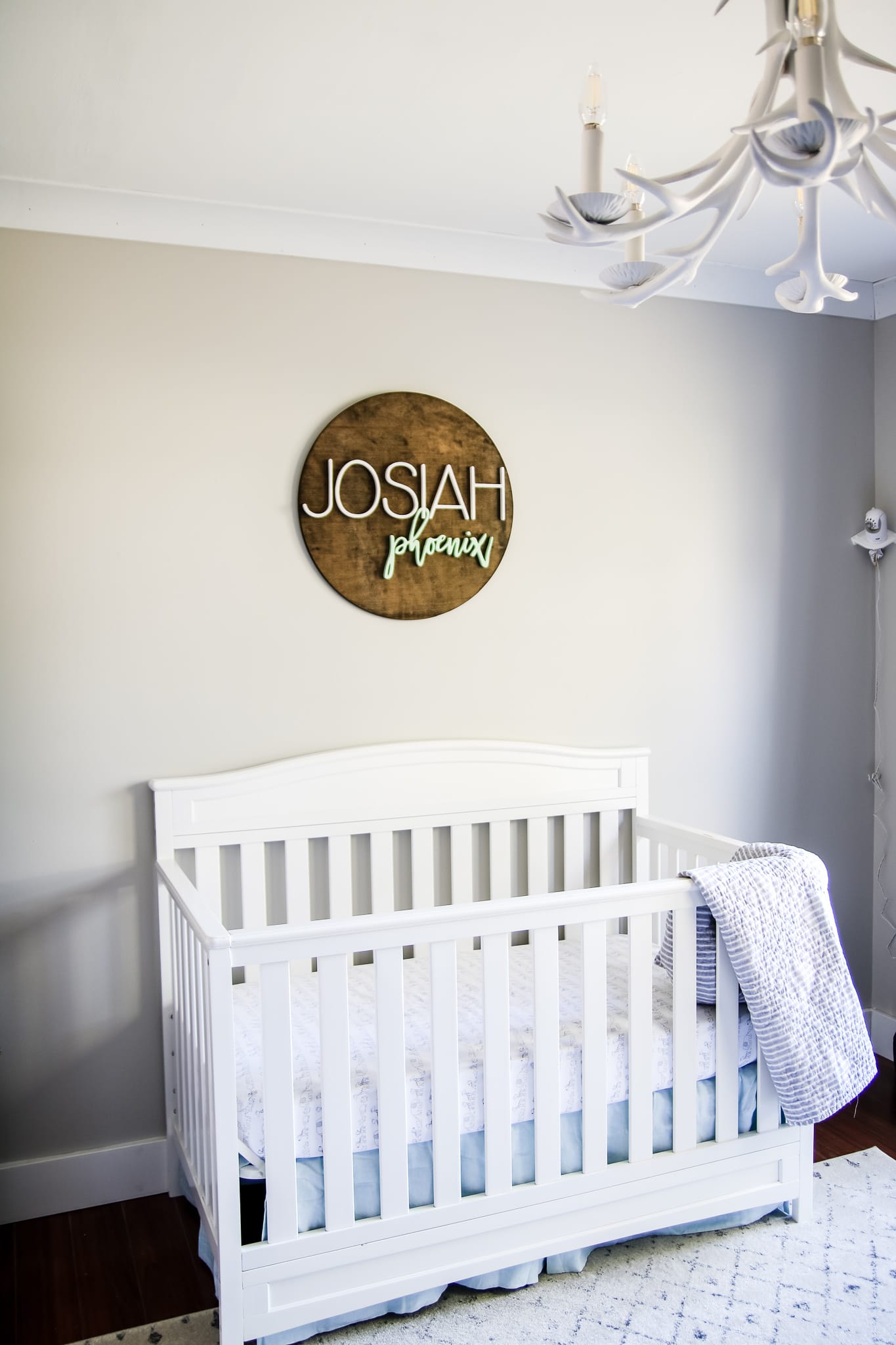 Nursery painted agreeable gray that shows both the warm and cooler side of the color