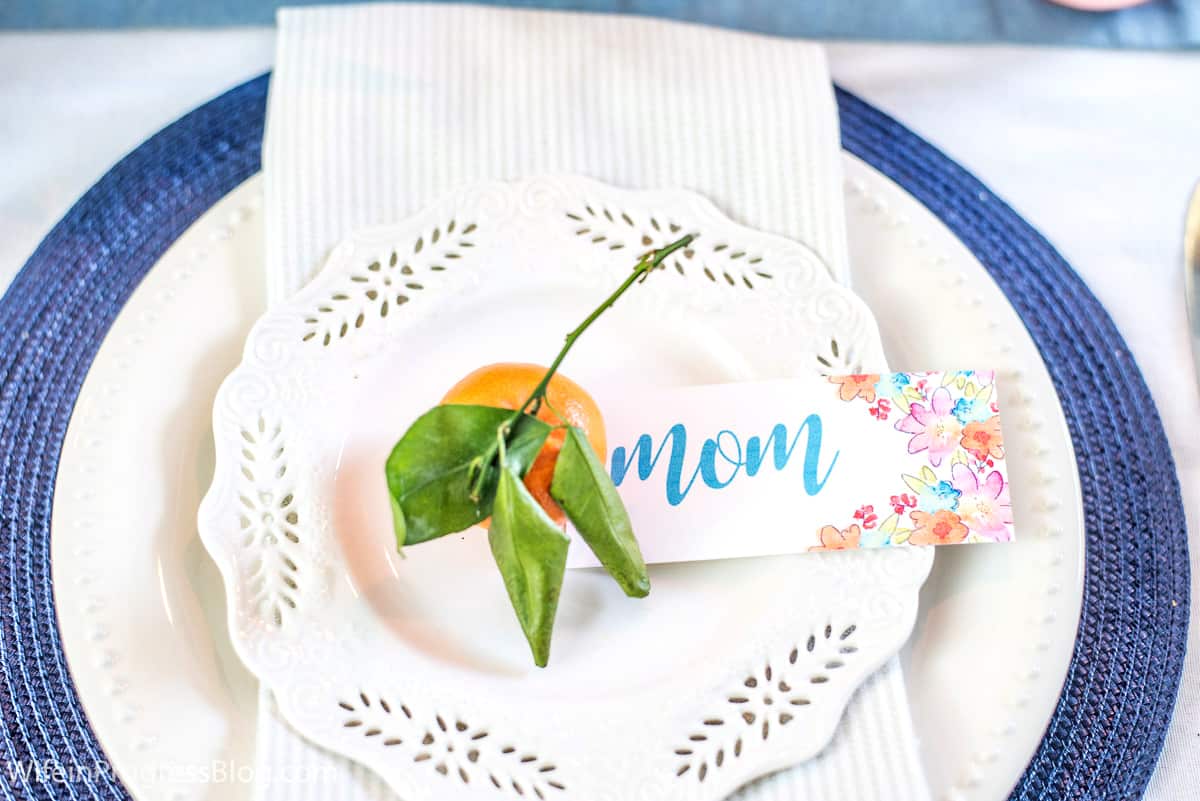 mother's day place setting with stemmed orange and handmade place card