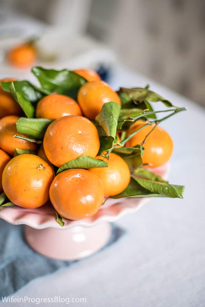 Mother's Day Brunch stemmed oranges on a dainty pink cake holder