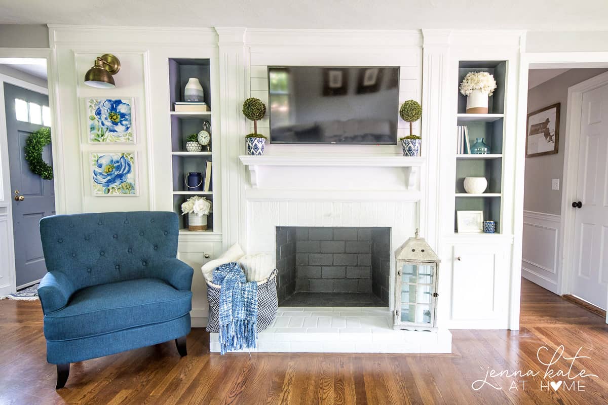 Navy blue accents, gray walls and plenty of crisp white for this coastal inspired living room