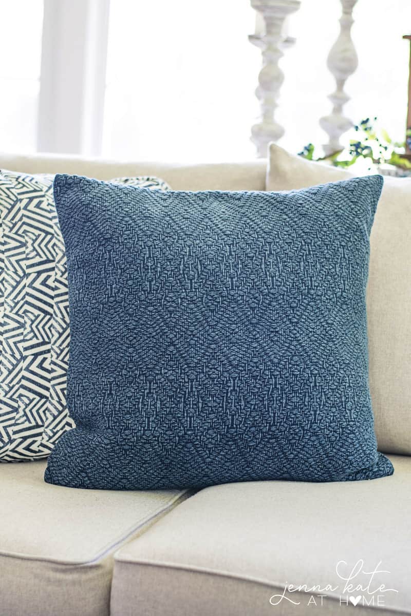 Beautiful textures on this navy blue throw pillow that's perfect for coastal styled homes