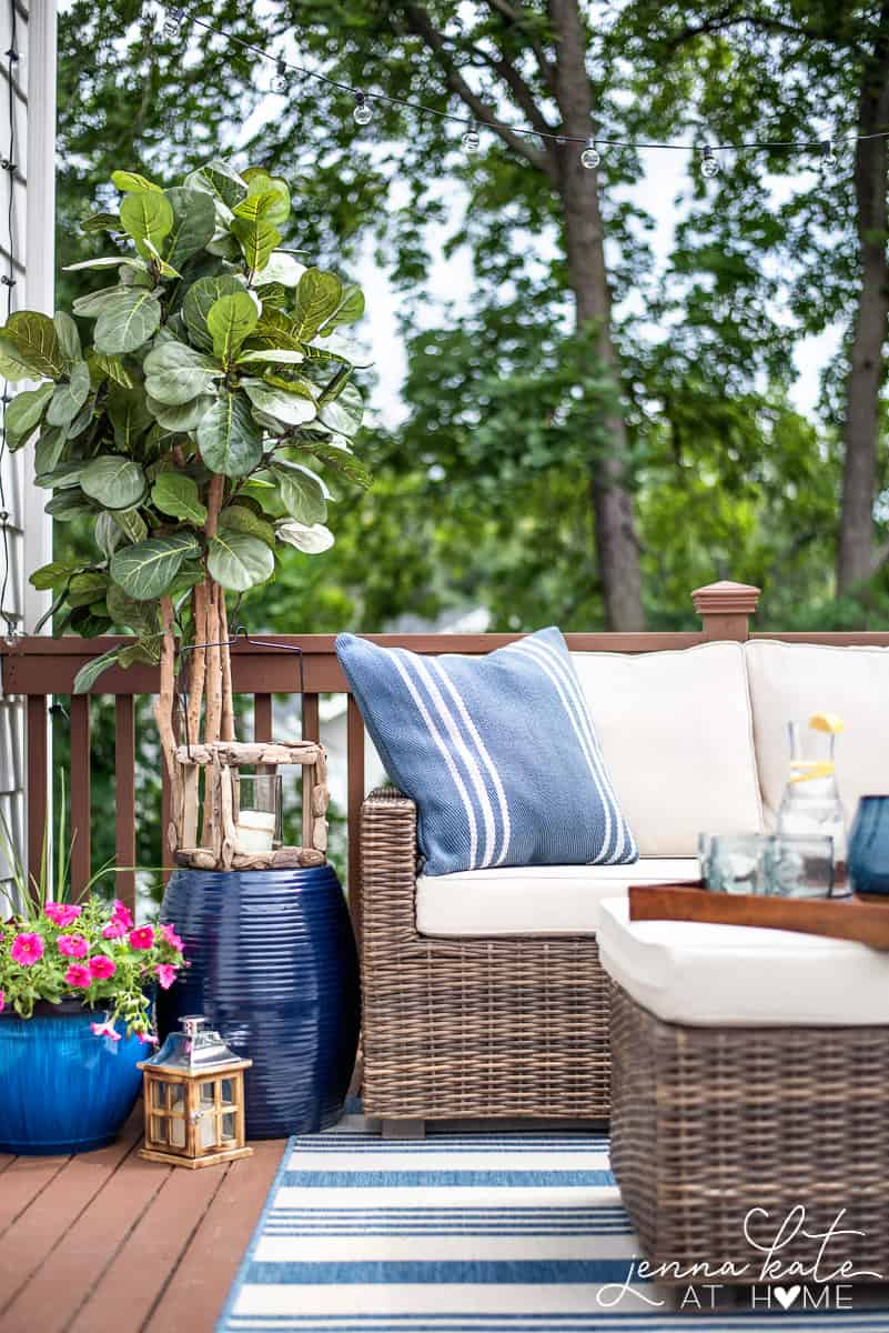 A small deck with string lights overhead