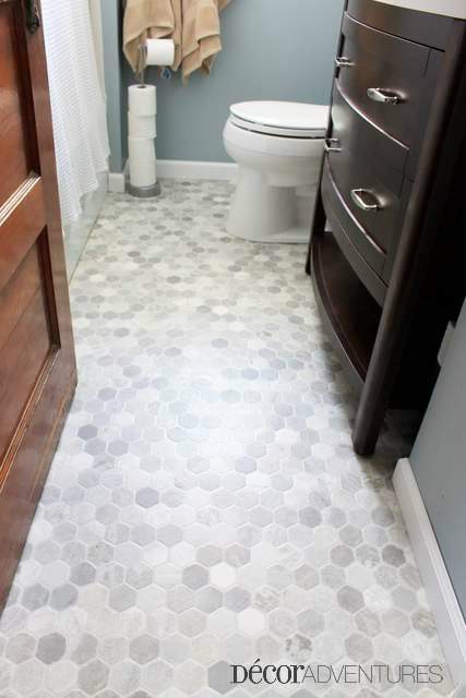 Modern sheet linoleum flooring is a cheap way to update a bathroom