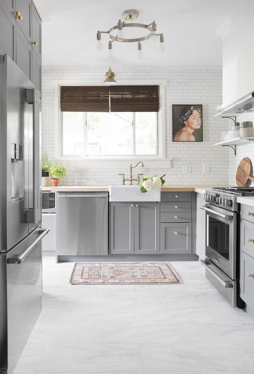 Kitchen with marble look luxury vinyl tile flooring