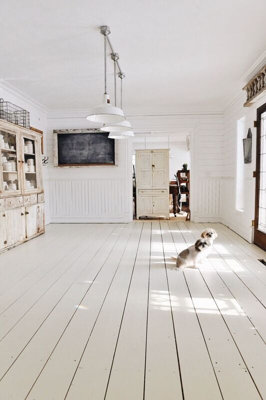 Old hardwood floors painted white with white walls, too