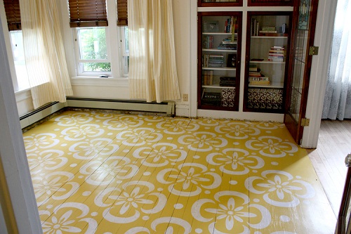 Yellow and white stenciled hardwood floors