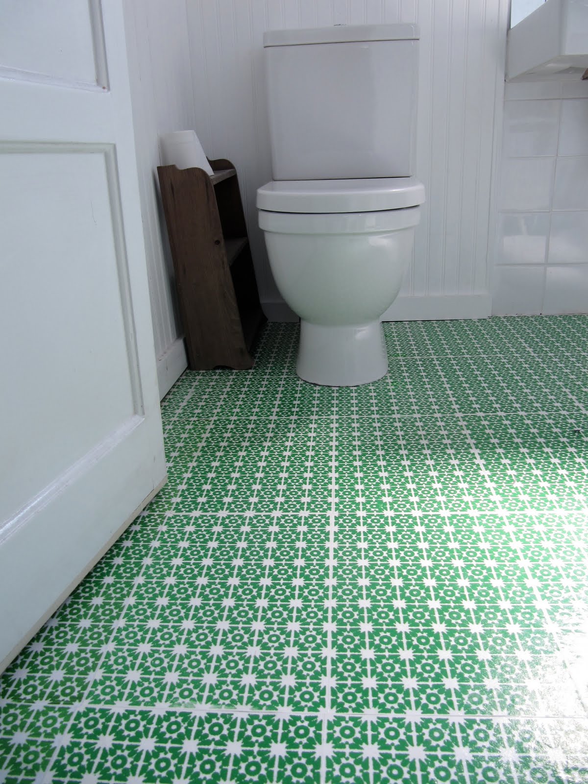 green wallpaper flooring in a bathroom