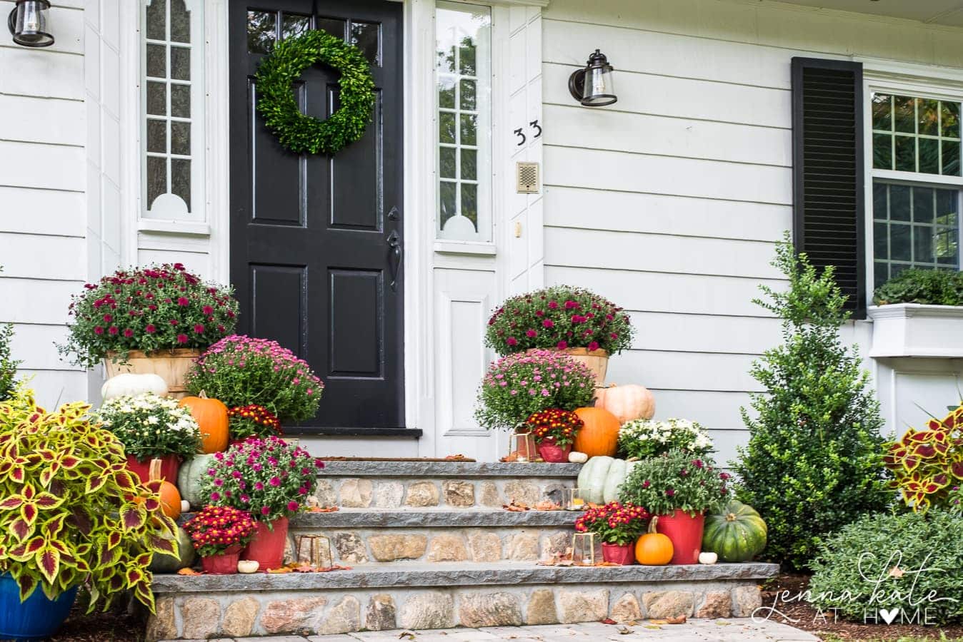 Traditional fall front porch decor with mums and pumpkins