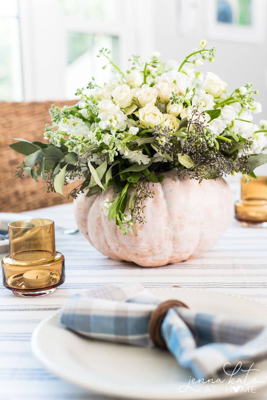 Creating a fall centerpiece with fresh flowers and a pumpkin