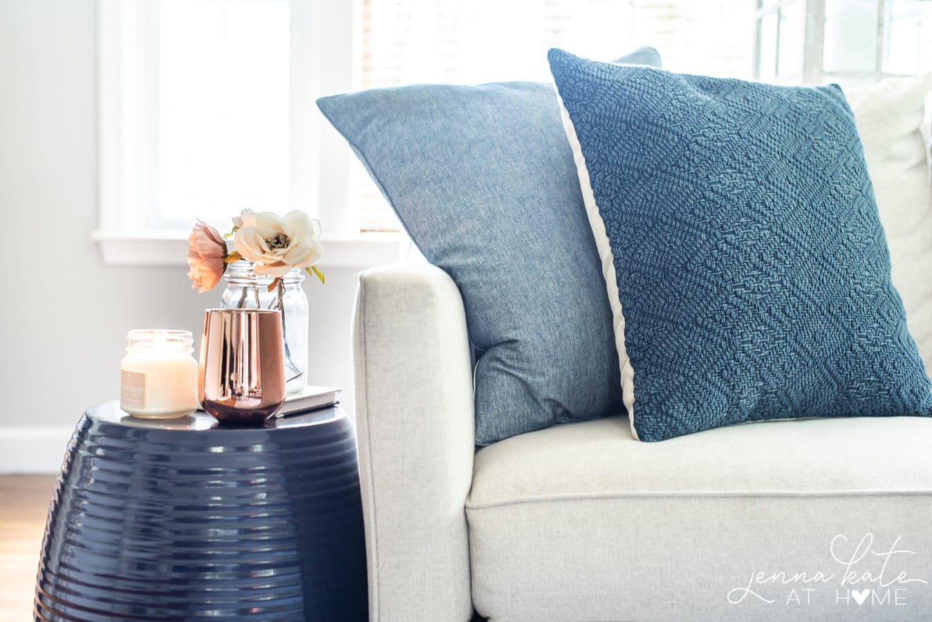 Blue throw pillows on couch.