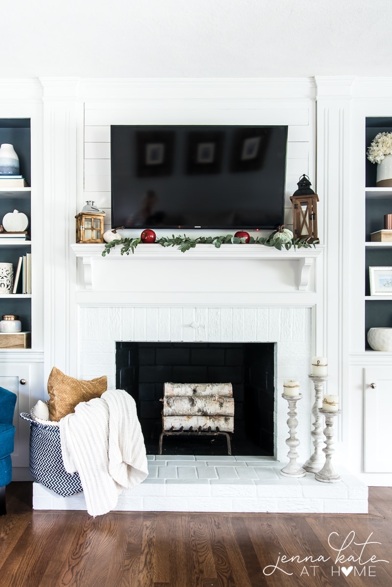This simple and affordable fall mantel decor is perfect for the winter holidays