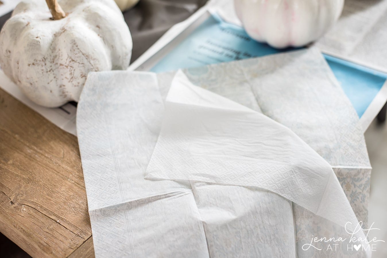 The bottom layer of napkins separated from the top floral print.