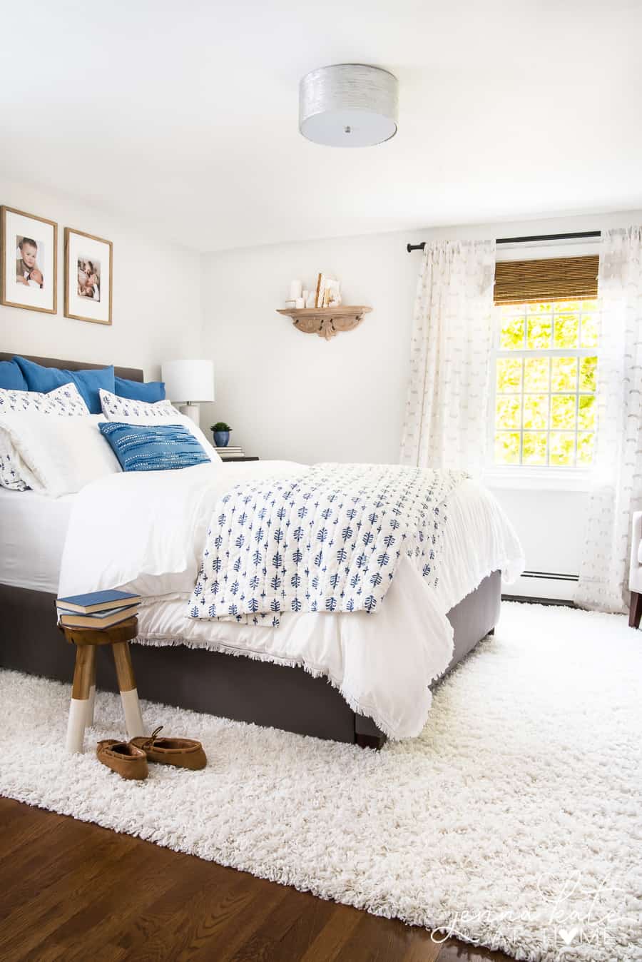 bedroom with bamboo shades on the window