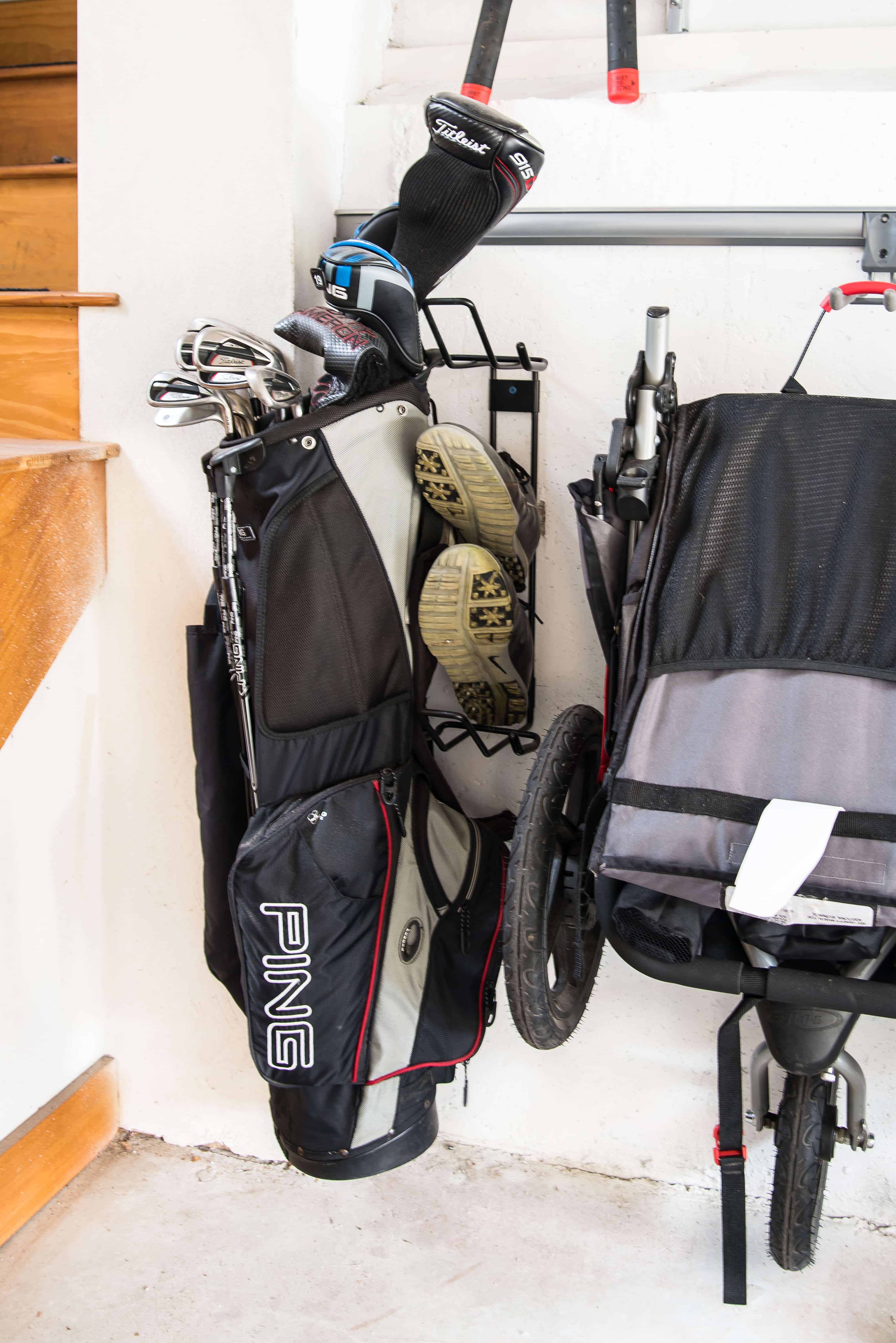 Golf bag hung up on garage track system