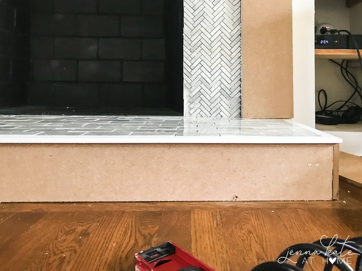 Tiling over painted brick fireplace