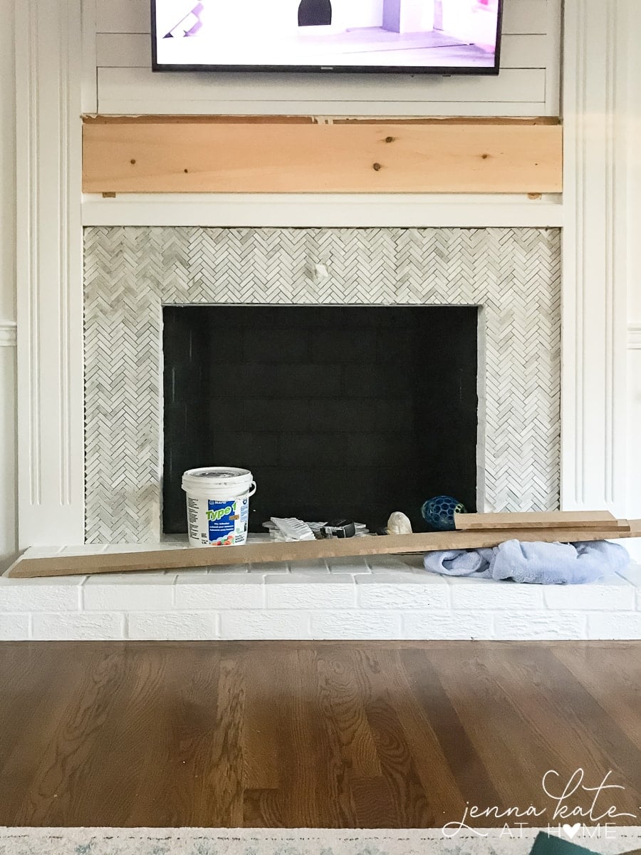 Mosaic tile over brick fireplace