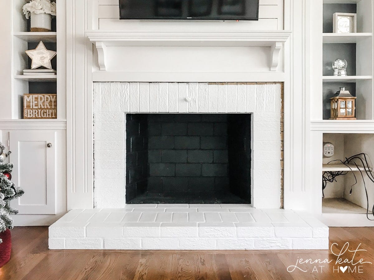 A close up of a fire place with trim removed around the surround