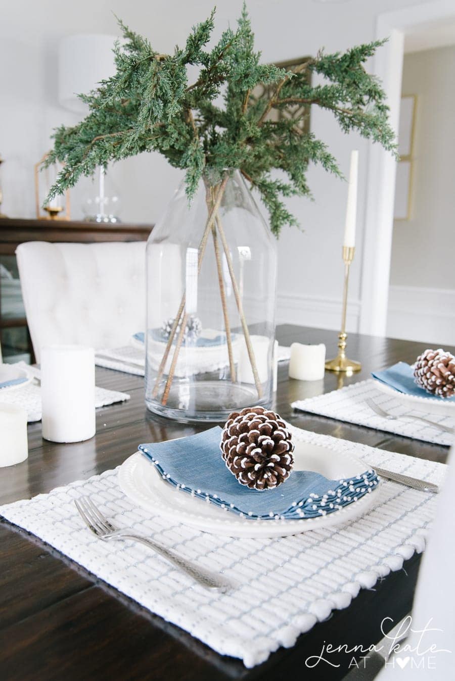 A complete look - pine cones, greenery, soft accents complete the winter tablescape 