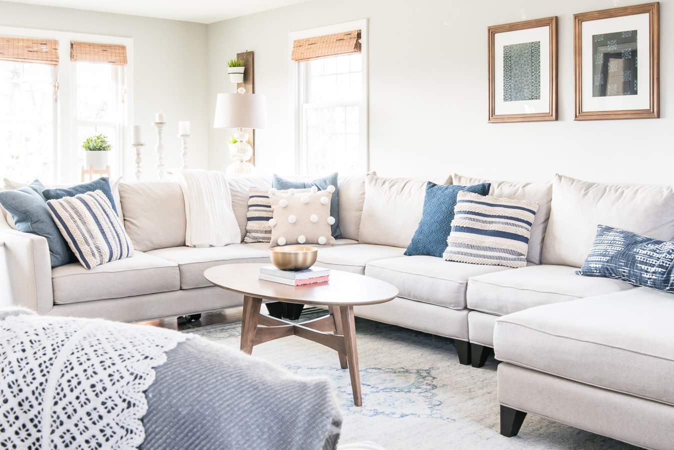 sectional couch with a coffee table and winter decor