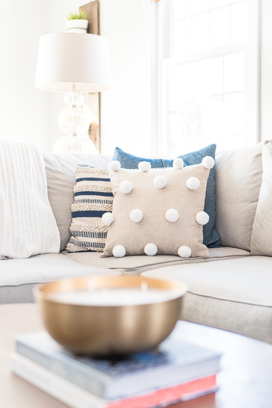 DIY pom pom pillow in couch