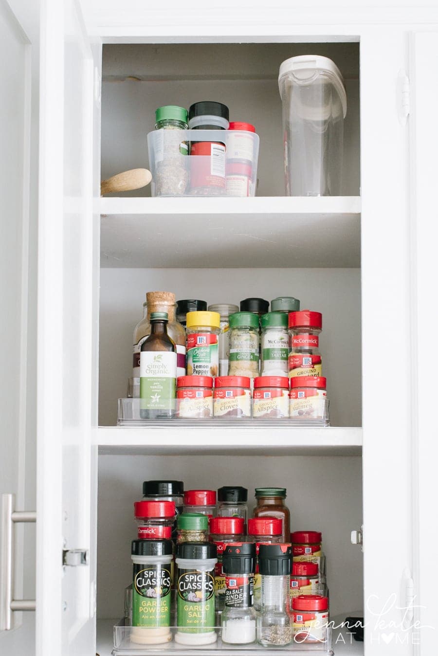 Tiered storage for spices in kitchen cupboards