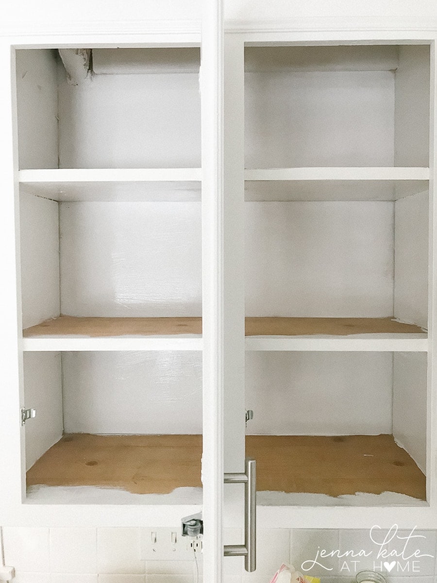 empty interior kitchen cabinet before organization