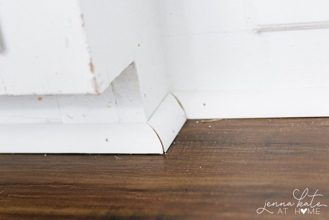 Secure the edges of vinyl plank flooring with shoe molding 