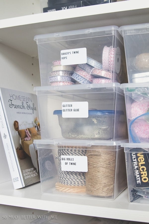 Label plastic bins and store like items together on bookshelves Organizing Craft Supplies via So Much Better with Age Jenna Kate at Home