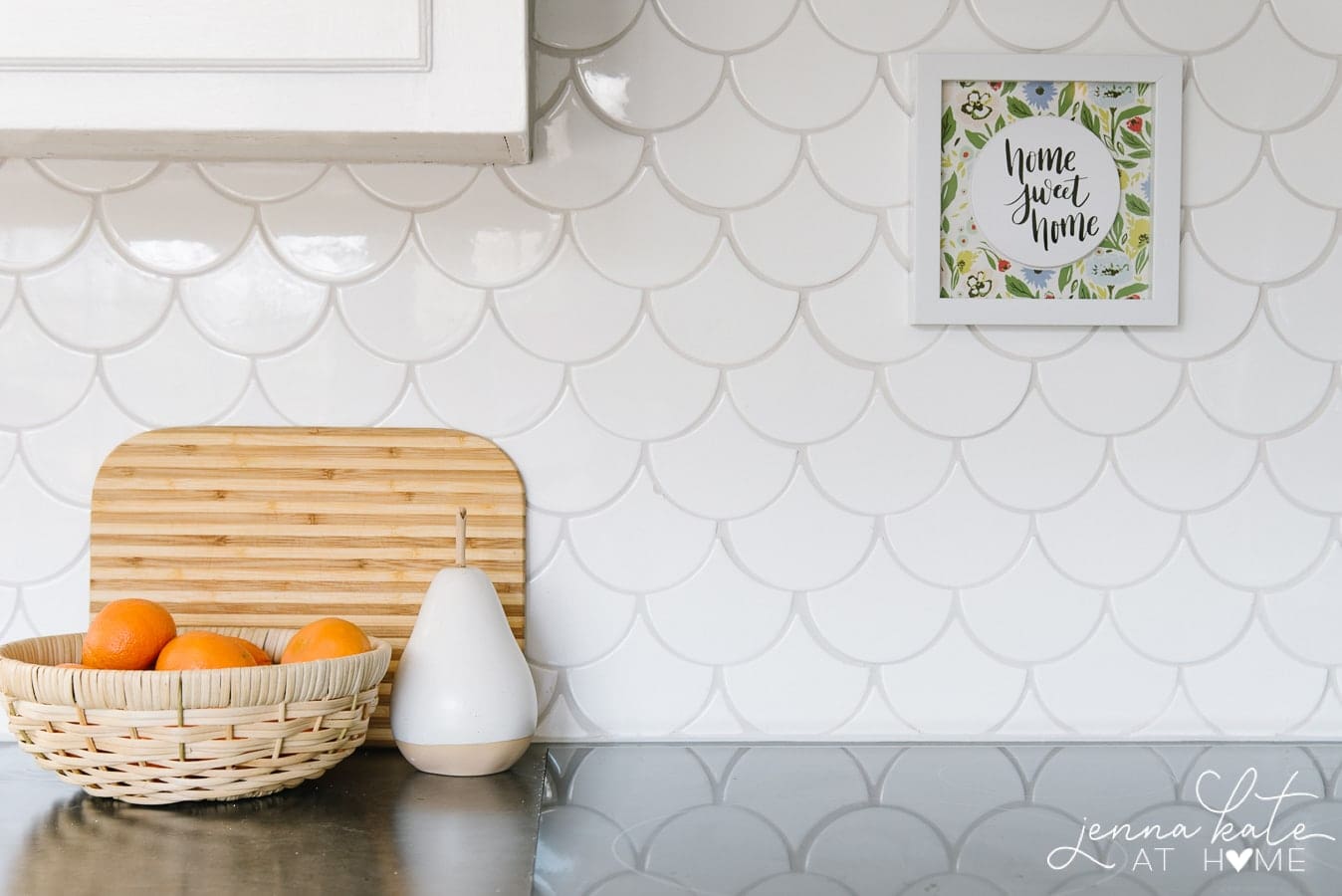 white scalloped backsplash tile