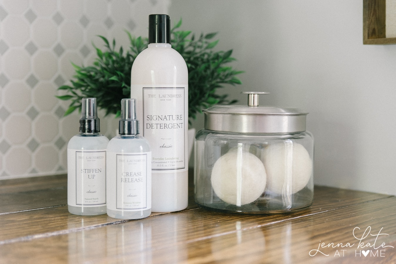 Various laundry essentials (starch, wool balls, stain remover etc.) sitting on a wooden shelf