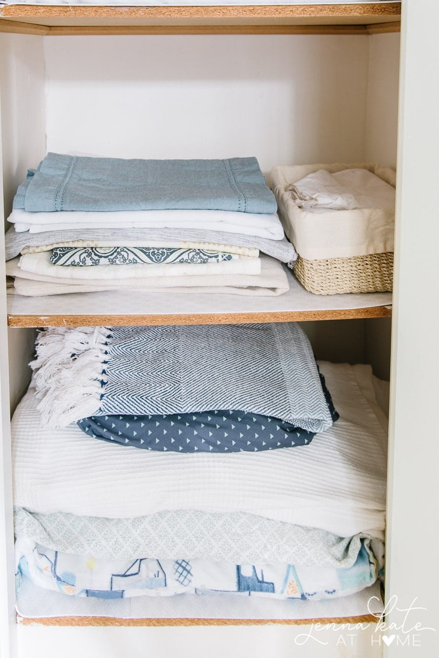 Sheets, pillowcases and other bedding on shelves of a linen closet