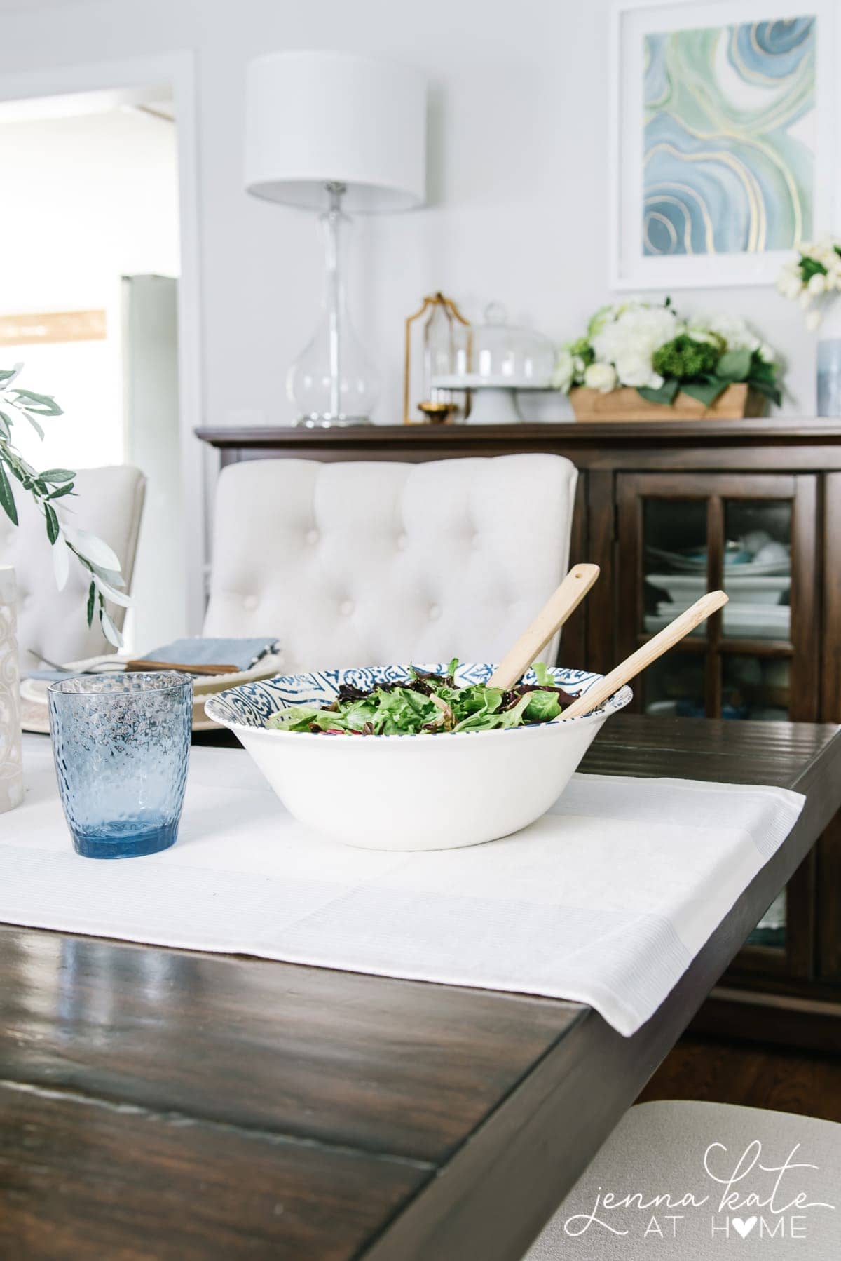 A simple coastal table setting that's perfect for summer with blue and white color scheme