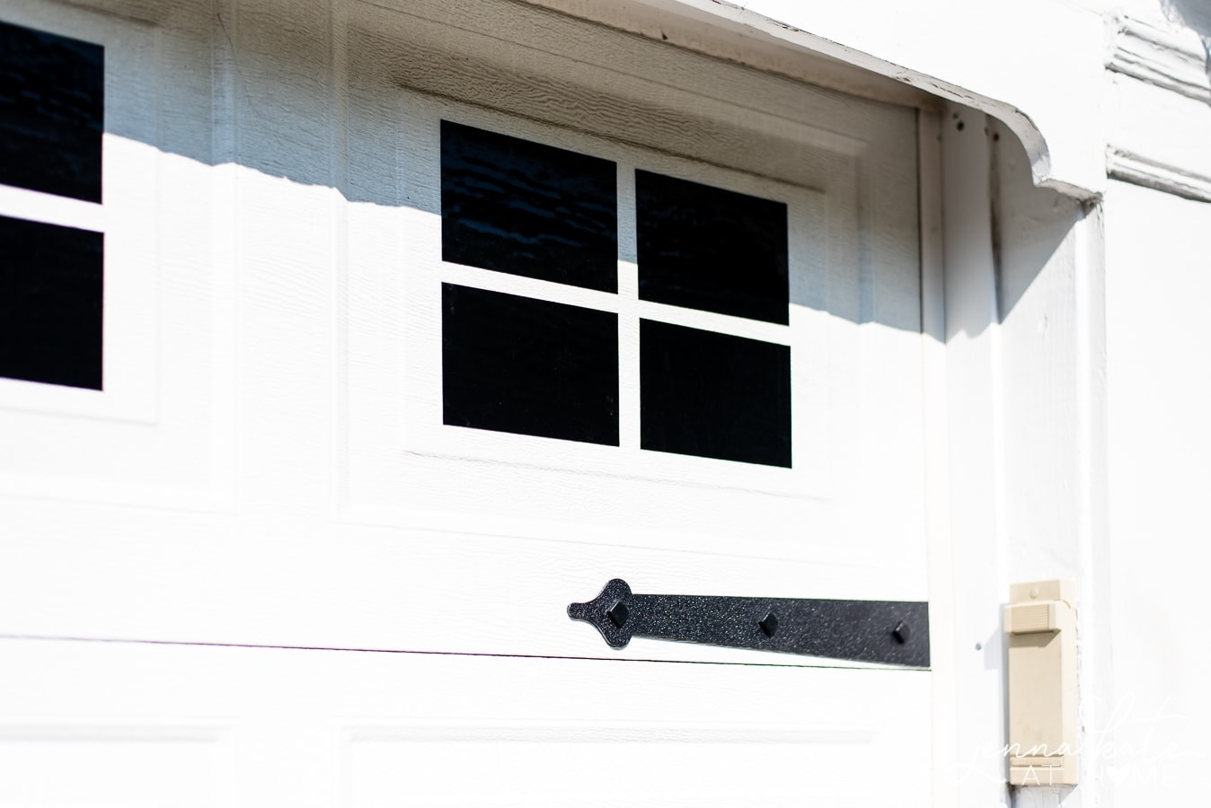 Close-up of four black vinyl rectangles grouped to resemble window panes