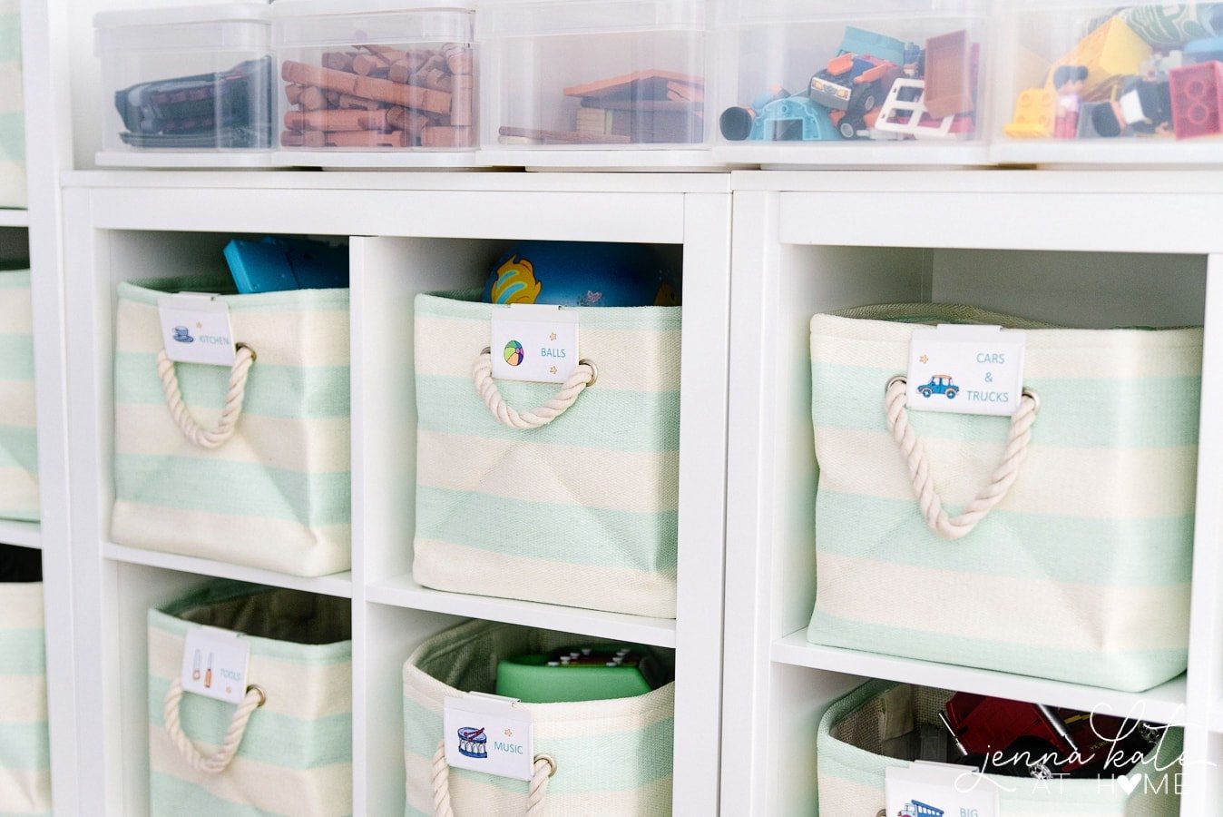 cube storage unit with striped totes filled with toys