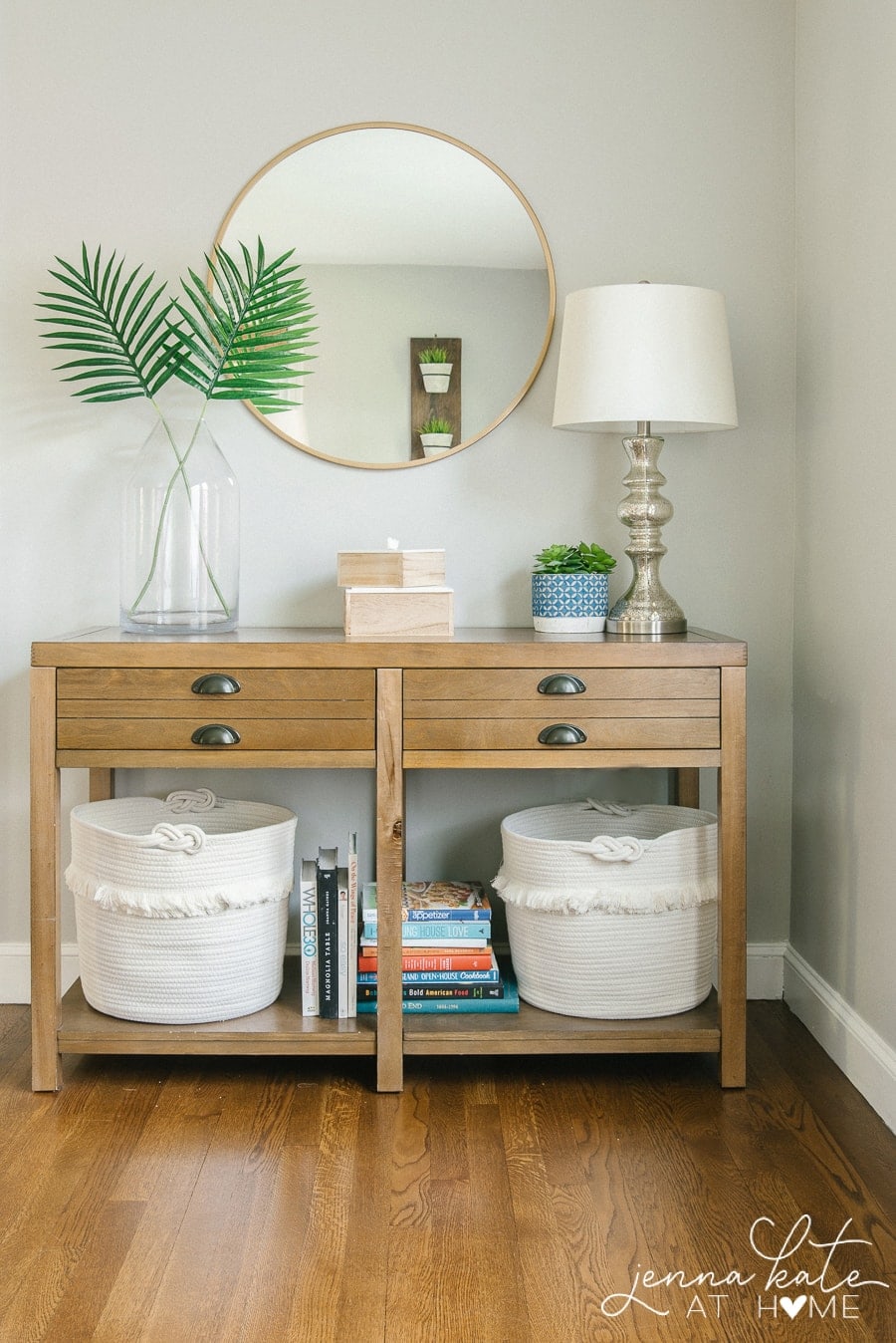 living room console table with toy storage baskets underneath is a great way to organize a small space