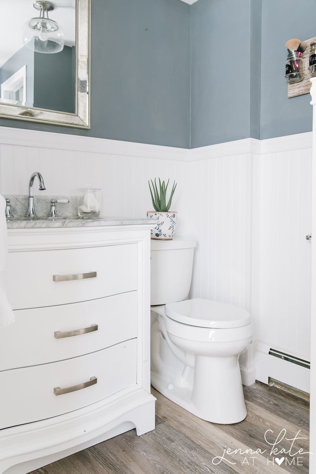 before of bathroom - white beadboard walls with dark gray-blue walls 