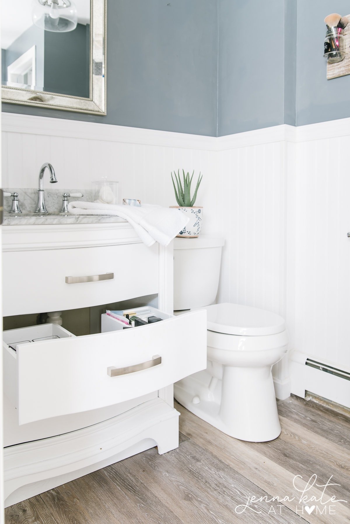 bathroom with white vanity and toilet