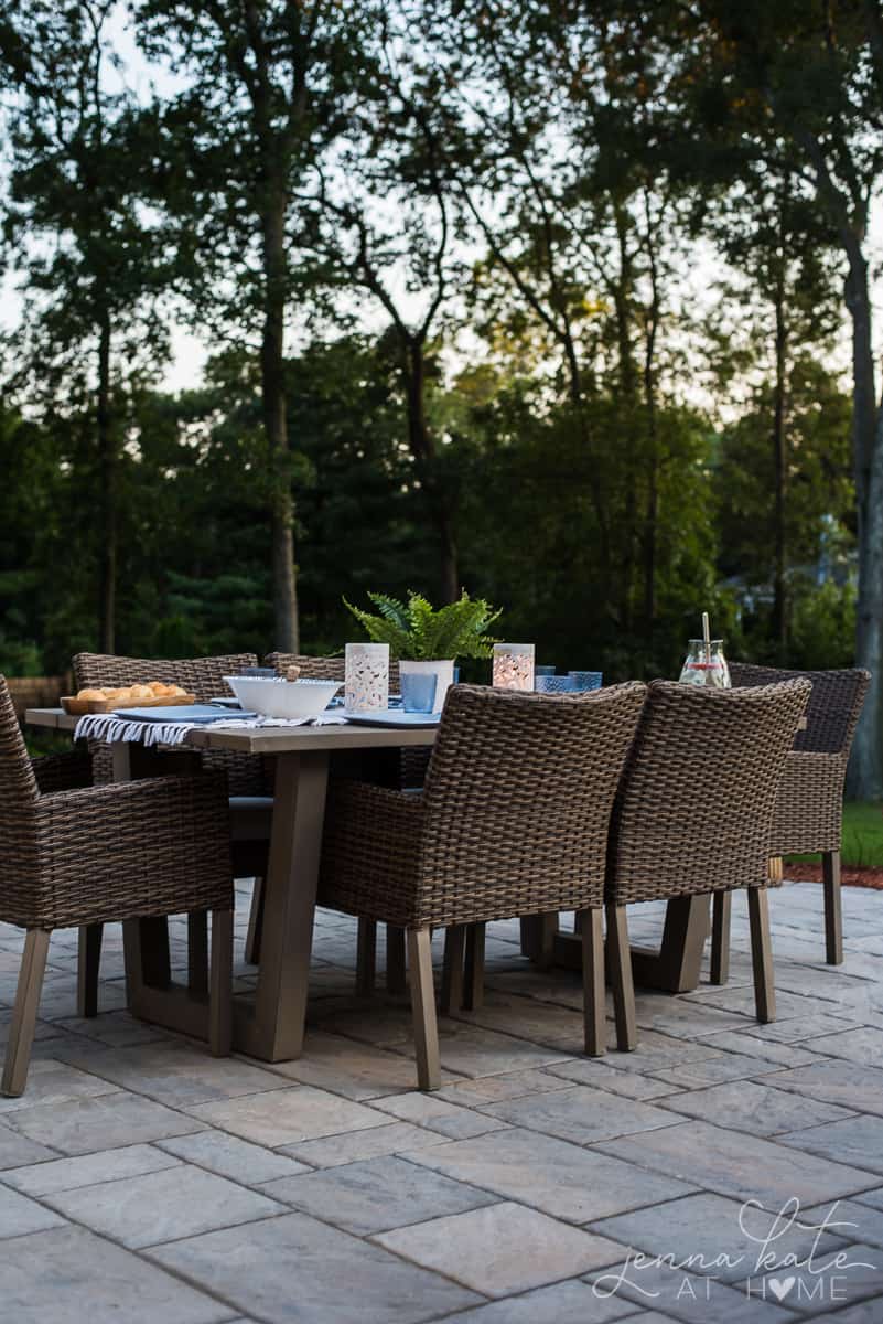 Our backyard patio dining table is adorned with glowing lanterns