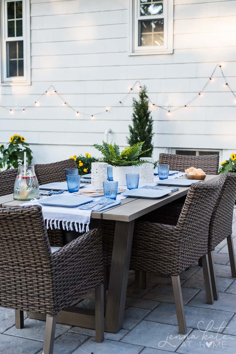 Our outdoor patio dining area decorated with white and blue coastal style place settings