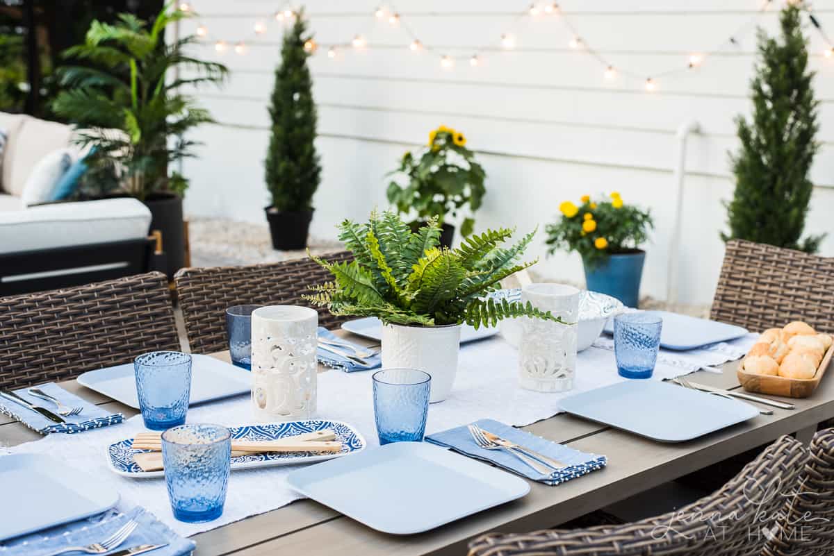 Our new Patio's dining area is decorated with blue and white coastal inspired place settings