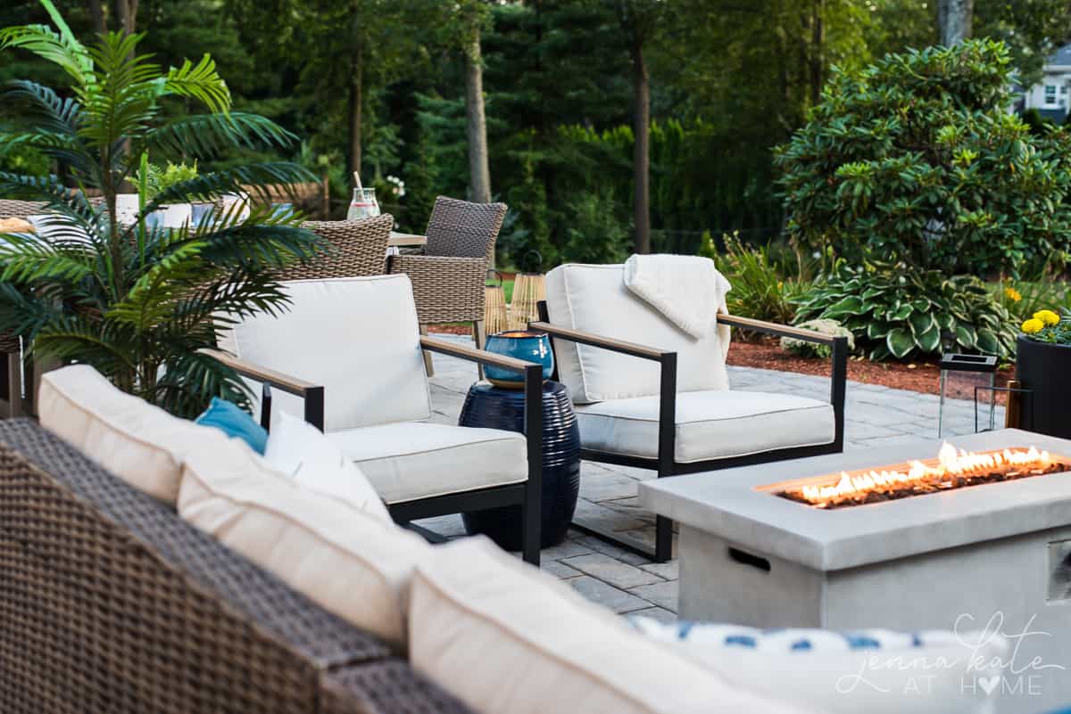 A warm and inviting seating area on our backyard patio has plentyyof room for friends and family to gather