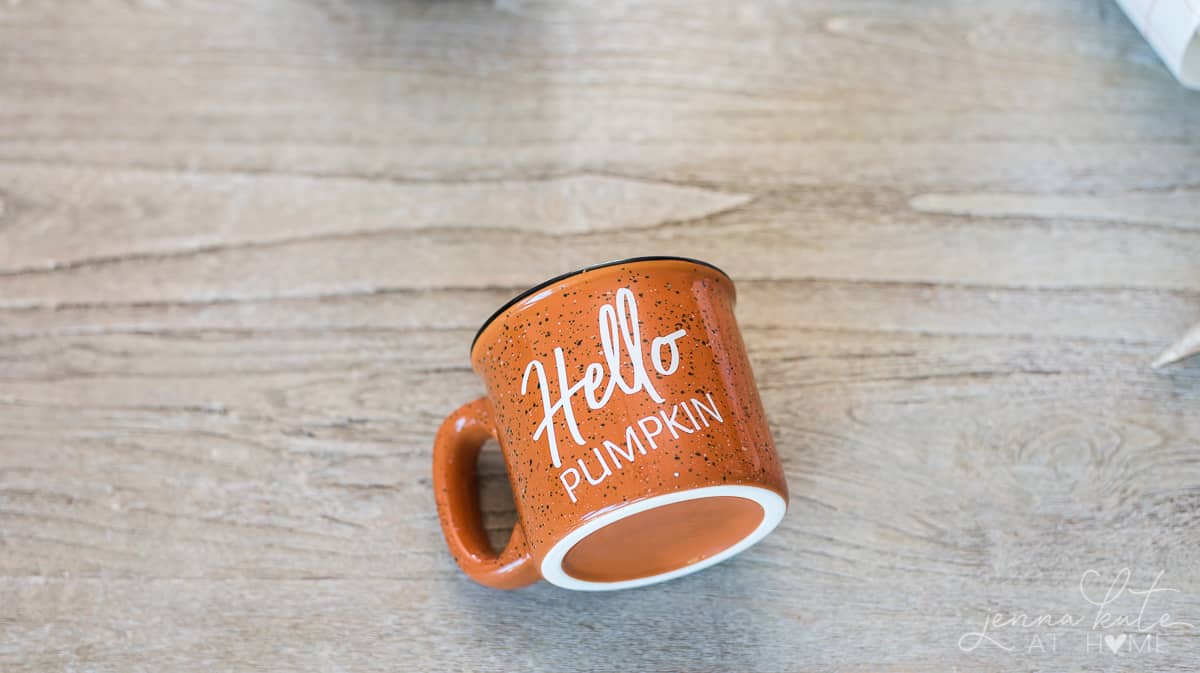 Orange ceramic mug with the words "Hello Pumpkin" in white vinyl