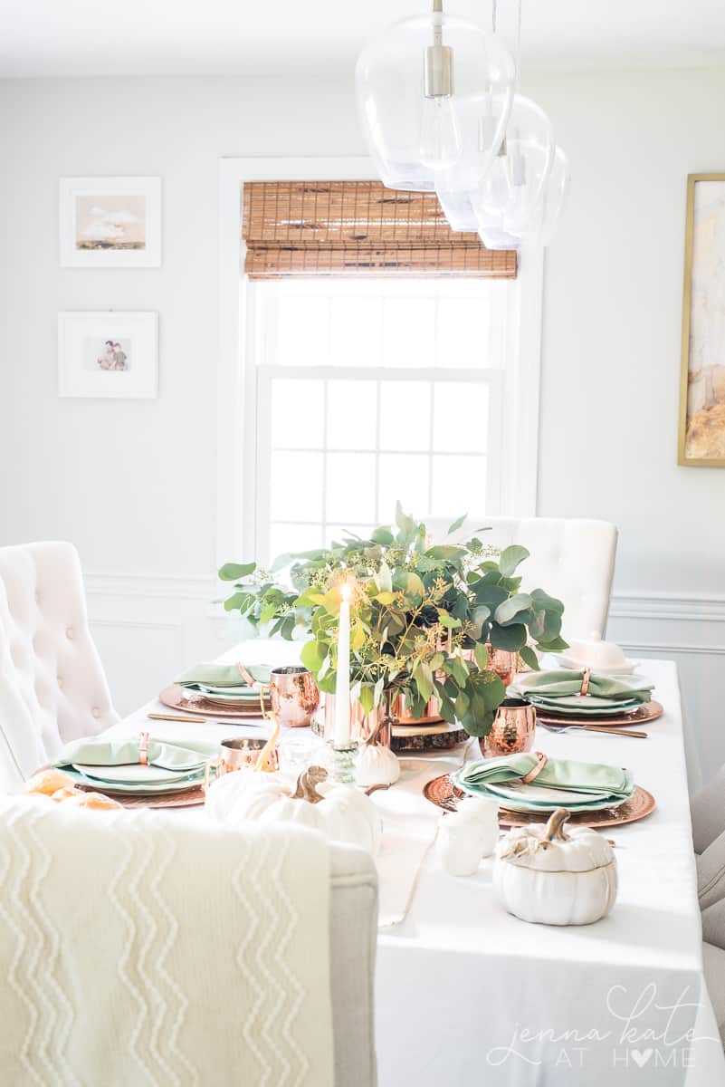 Thanksgiving table setting with copper and eucalyptus centerpiece