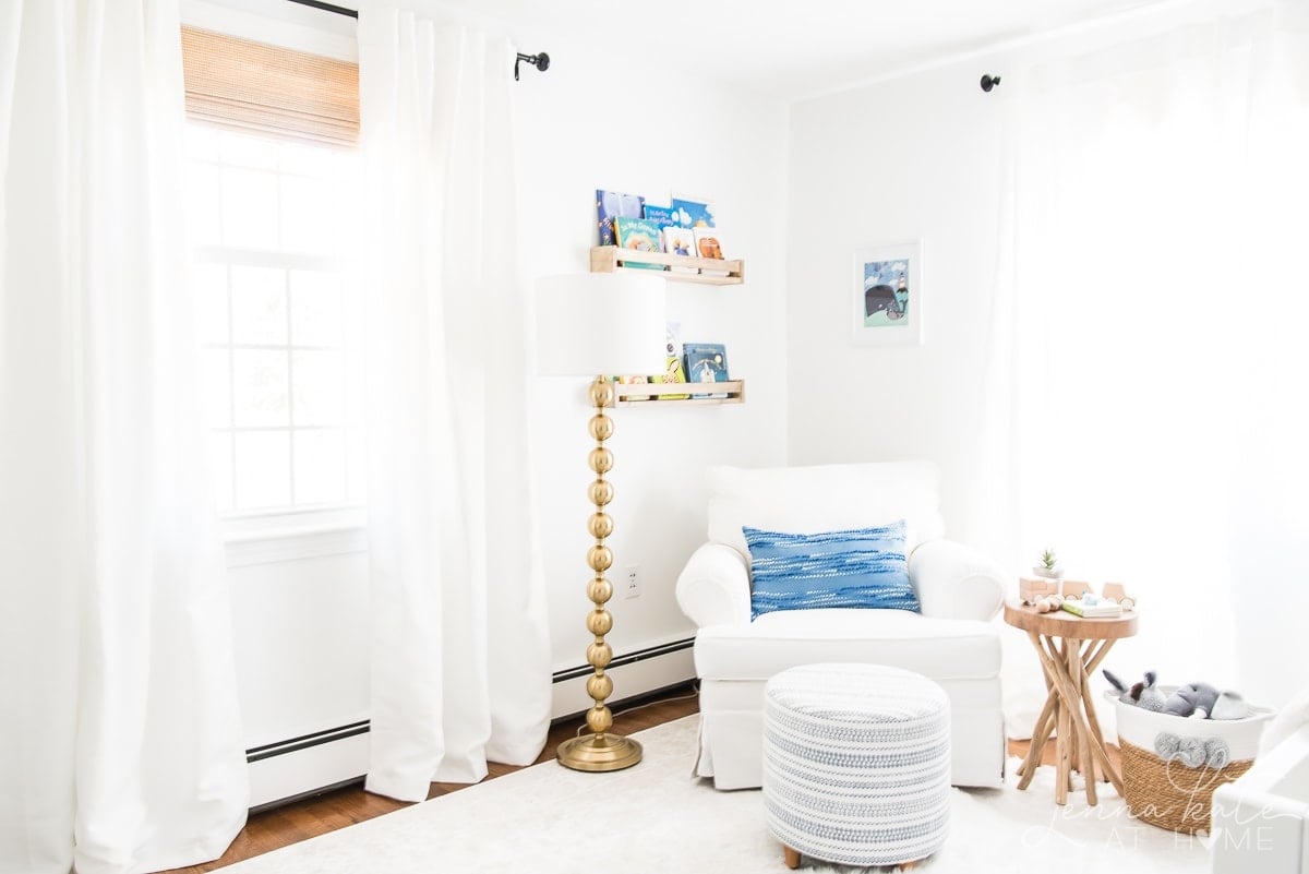 Nursery with white walls and white glider