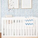 Nursery with serena and lily wallpaper and white crib