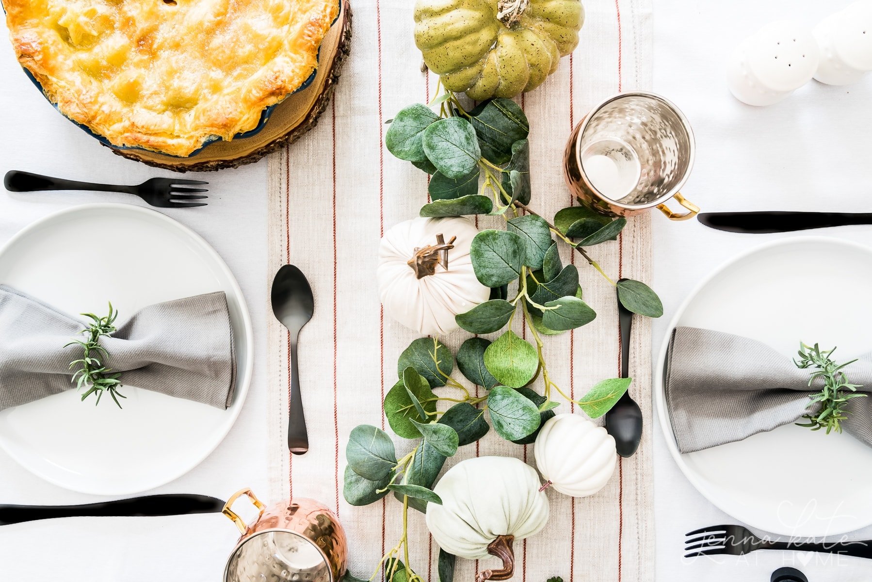 Nature inspired harvest fall tablescape using faux greenery and pumpkins